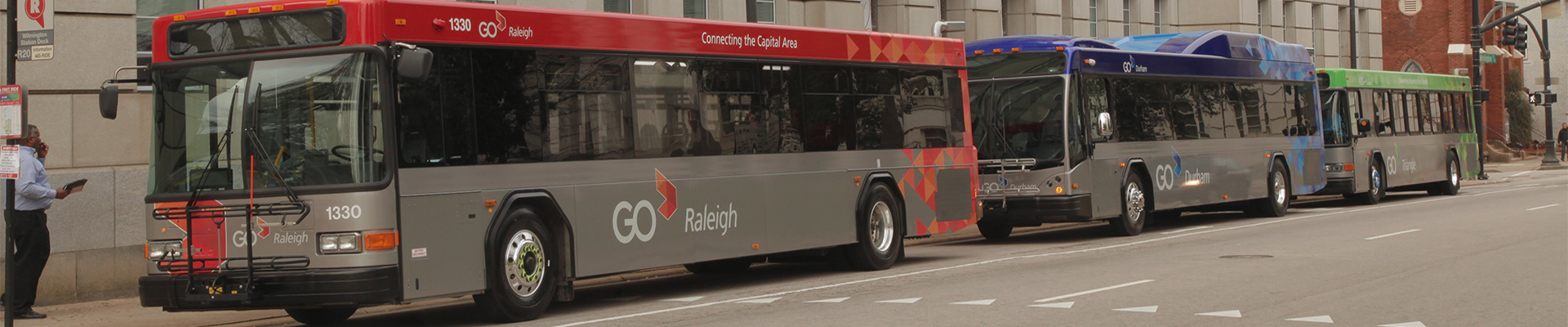 A GoRaleigh bus, a GoDurham bus and a GoTriangle bus parked next to each other