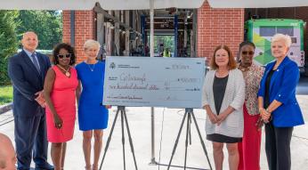 Rep. Ross presents check to GoTriangle for FY2023 bus stop improvements
