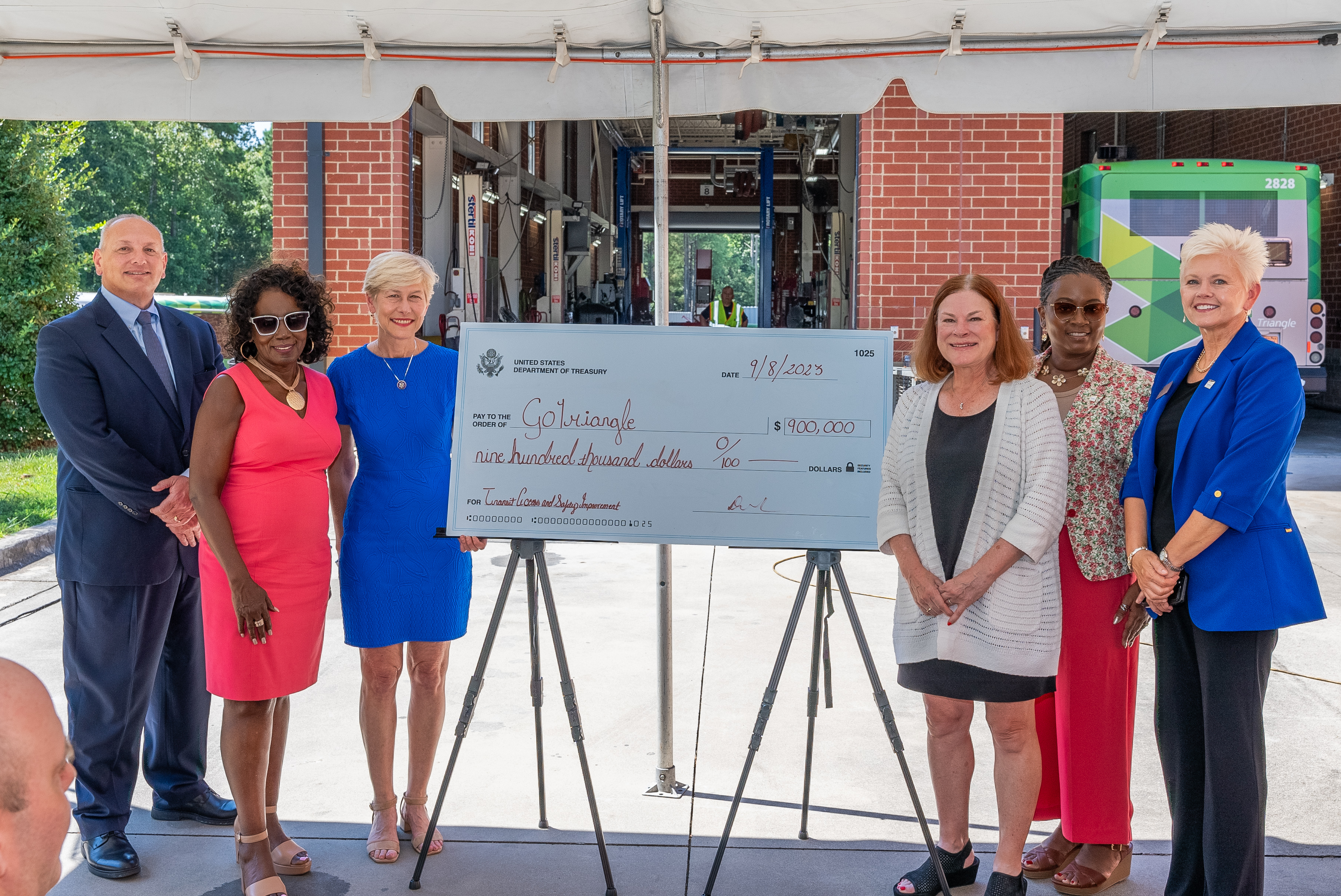 Rep. Ross presents check to GoTriangle for FY2023 bus stop improvements